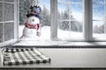 Kitchen table with christmas decorations blurred kitchen background. Royalty Free Stock Photo