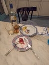 Kitchen table with dinner leftovers eaten by a lonely person during the coronavirus lookdown