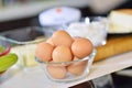 Kitchen table with eggs on basket, focus from top view kitchen table. Royalty Free Stock Photo