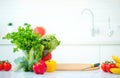 Kitchen table with fresh organic vegetables and fruits Royalty Free Stock Photo