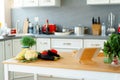 Kitchen table with frsh vegetables and digital tablet