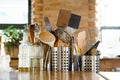 kitchen table.metal stands with cutlery,glass bottles with olive oil and vinegar