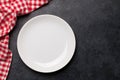 Kitchen table with plate and tablecloth Royalty Free Stock Photo