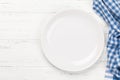 Kitchen table with plate and tablecloth Royalty Free Stock Photo