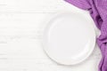 Kitchen table with plate and tablecloth Royalty Free Stock Photo