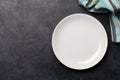 Kitchen table with plate and tablecloth Royalty Free Stock Photo