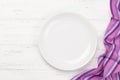 Kitchen table with plate and tablecloth Royalty Free Stock Photo
