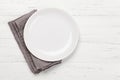 Kitchen table with plate and tablecloth Royalty Free Stock Photo