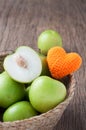 Kitchen table with slice fresh monkey apple on basket. healthy e