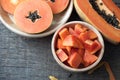 Kitchen table with slice fresh papaya on wood plate, Fruit for t Royalty Free Stock Photo
