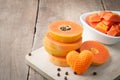 Kitchen table with stack layer slice fresh papaya, papaya and or Royalty Free Stock Photo