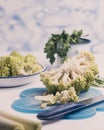 Kitchen table where they are preparing broccoli of the romanescu variety