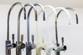 Kitchen taps of different colors Royalty Free Stock Photo