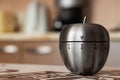Kitchen timer in shape of apple on table. Space for text Royalty Free Stock Photo