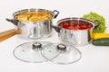 Kitchen tools; stainless steel pots set, photo on white background Royalty Free Stock Photo
