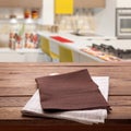 Kitchen towel on empty wooden table. Napkin close up top view mock up for design. Kitchen rustic background. Royalty Free Stock Photo