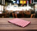 Kitchen towel on empty wooden table. Napkin close up top view mock up for design. Kitchen rustic background. Royalty Free Stock Photo