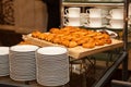 Kitchen tray with the cakes and clean dishes Royalty Free Stock Photo