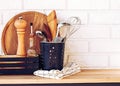 Kitchen utensils and assessories for cooking standing on the wooden table Royalty Free Stock Photo