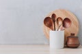 Kitchen utensils background. Wooden spoons and cutting board on light background with copy space Royalty Free Stock Photo