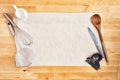 Kitchen utensils on crumpled piece of baking paper Royalty Free Stock Photo