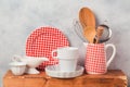 Kitchen utensils and dishware on wooden board Royalty Free Stock Photo