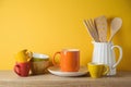 Kitchen utensils and dishware on wooden shelf. Autumn kitchen interior background Royalty Free Stock Photo