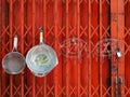 Kitchen utensils are hung on closed retractable folding metallic gates