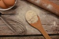 Kitchen utensils and ingredients to prepare sweet cake on wooden table or fresh pasta Royalty Free Stock Photo