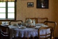 Kitchen utensils in the interior of old traditional rural wooden house. Royalty Free Stock Photo