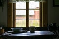 Kitchen utensils in the interior of old traditional rural wooden house. Royalty Free Stock Photo