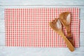 Kitchen utensils with red checked tablecloth on rustic wooden table Kitchen, cooking or baking mock up background for design Royalty Free Stock Photo