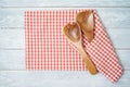 Kitchen utensils with red checked tablecloth on rustic wooden table Kitchen, cooking or baking mock up background for design. Top Royalty Free Stock Photo