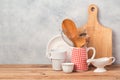 Kitchen utensils and tableware on wooden table over rustic background Royalty Free Stock Photo