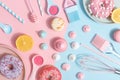 Kitchen utensils and tools, pastries and sweets on a pink and blue background. Top view. Copy space Royalty Free Stock Photo