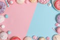 Kitchen utensils and tools, pastries and sweets on a pink and blue background. Top view. Copy space Royalty Free Stock Photo