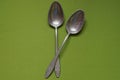 Kitchen utensils from two old gray aluminum spoons Royalty Free Stock Photo