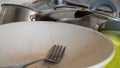 The kitchen utensils in the wash basin need to be washed. A pile of dirty dishes in the kitchen sink. Kitchen utensils need Royalty Free Stock Photo