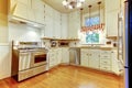 Kitchen view interior with hardwood fllor and white cabinets Royalty Free Stock Photo