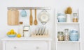 Kitchen wall decorated interior with cabinet and shelf with utensils Royalty Free Stock Photo