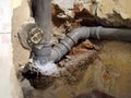 Kitchen wall detail with new plumbing pipes being installed in the wall under the tiles