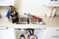 Kitchen Water tap and sink. Royalty Free Stock Photo