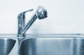 Kitchen Water tap and sink. Royalty Free Stock Photo