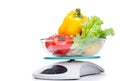 Kitchen weight scale with vegetables. Royalty Free Stock Photo