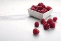 Kitchen white bowl of ripe rasberries on the table.Empty space Royalty Free Stock Photo