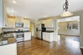 Kitchen with white cabinets and granite tops