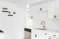 A kitchen with white cabinets and subway tile. Royalty Free Stock Photo