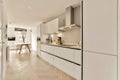 a kitchen with white cabinets and a wooden floor Royalty Free Stock Photo