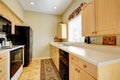 Kitchen with white counters and decorative rug