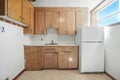 Kitchen with a white refrigerator and cabinets Royalty Free Stock Photo
